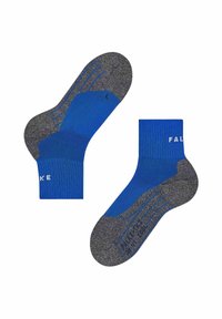 Blå och grå ankelsockor med förstärkta häl- och tåområden, en visar sulan med grepplinjer och storleksmarkeringar.