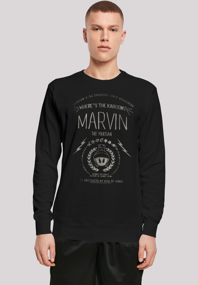 Sweatshirt noir avec un imprimé graphique de Marvin le Martien, accompagné de détails textuels et de motifs d'éclairs dans une couleur contrastante.