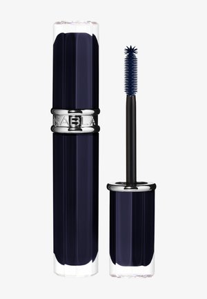 Tube de mascara bleu foncé avec applicateur assorti doté d'une brosse en silicone en forme d'étoile à pointes.