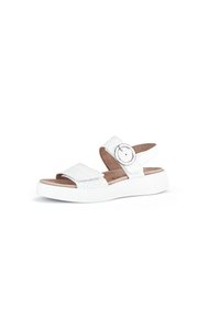 Witte sandalen met geweven banden, een ronde gespaccent, en een dikke witte zool, met een natuurlijk voetbed voor comfort.