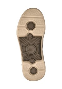 Schoenzool met een donkere bruine rubbertextuur en een crèmekleurige buitenzool, cirkelvormige accenten en groeven voor grip.