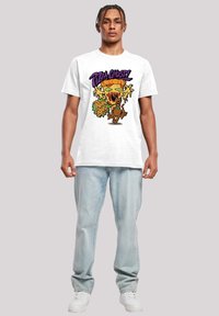 White cotton t-shirt featuring a colorful graphic of a dripping pizza ghost and a cartoon dog with text saying "Pizza Ghost!" and "Ruh Roh!"