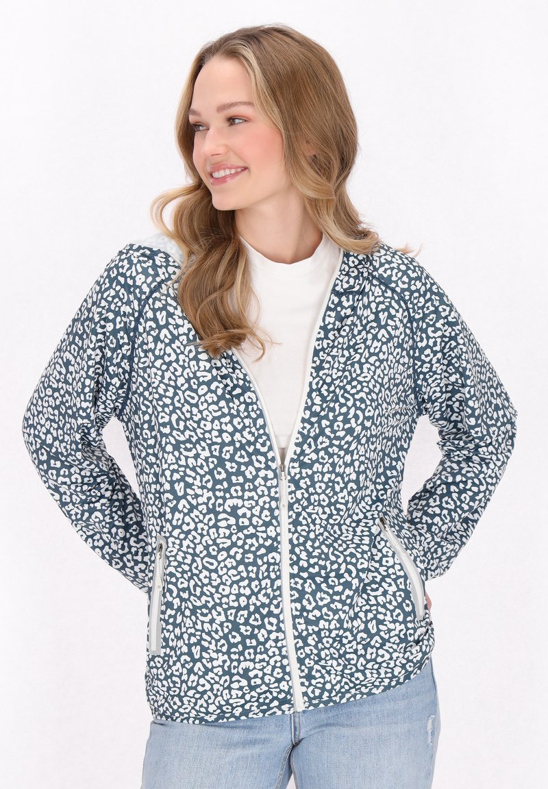 Leopardmönstrad jacka i teal och vitt, med dragkedja fram, sidofickor och textil med struktur. Har en avslappnad passform och långa ärmar.