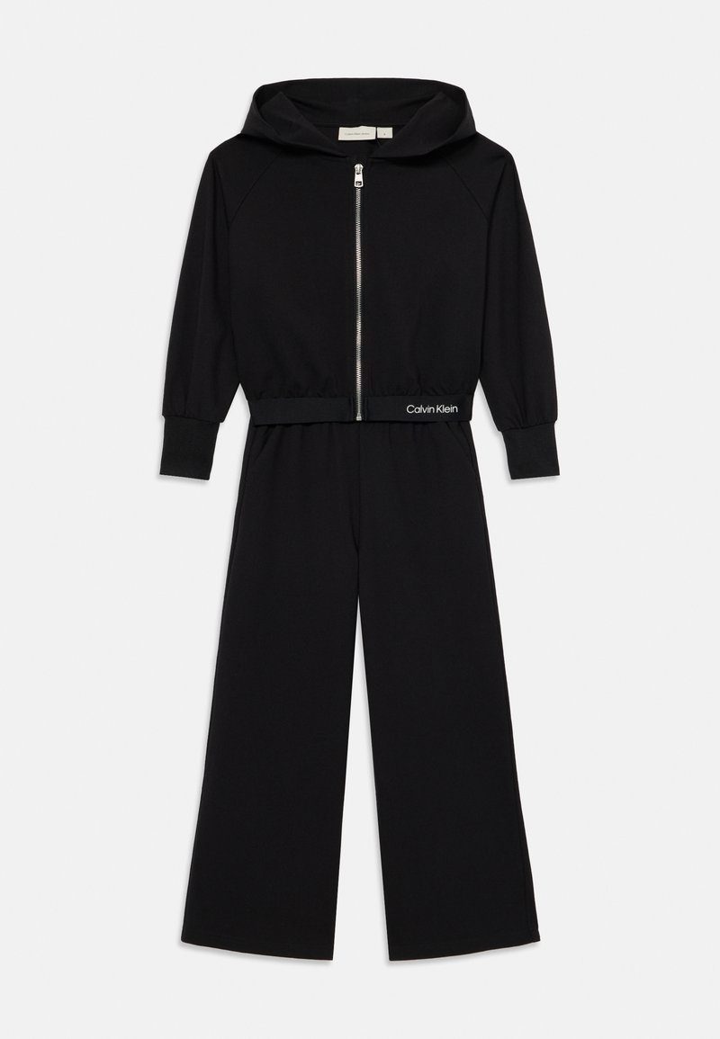 Mono con capucha negro, de manga larga y con cremallera frontal. Presenta una cintura ajustada con el logo de Calvin Klein, fabricado en un tejido suave.