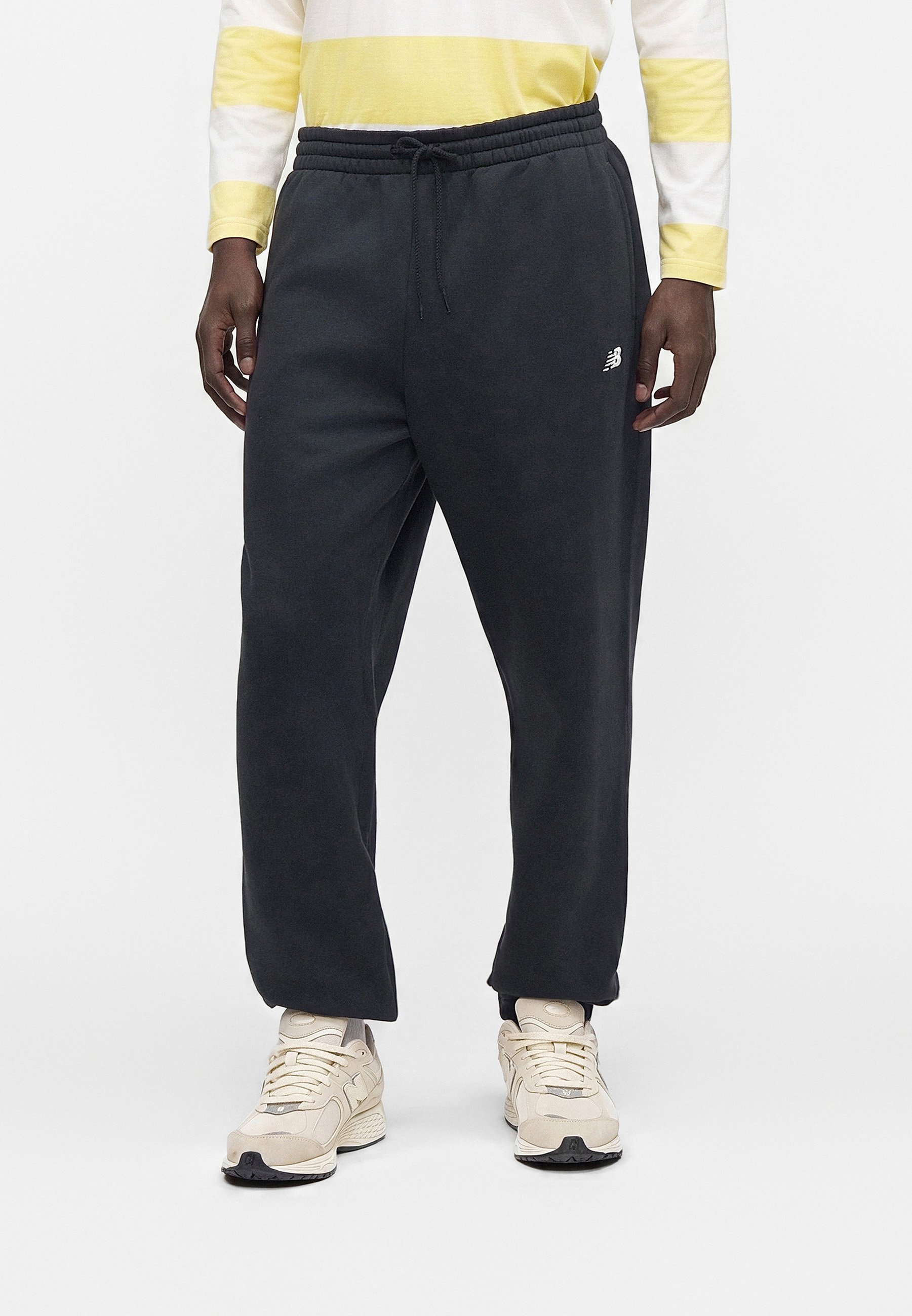 New Balance SPORT ESSENTIALS JOGGER - Tracksuit bottoms - black