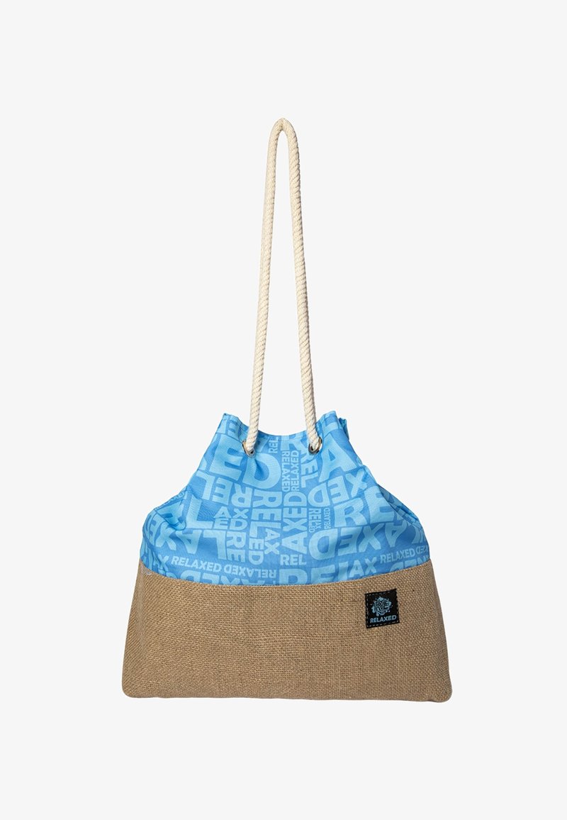 Blue and brown tote bag with repeated "RELAXED" text, featuring thick white rope handles and a small black patch with logo.