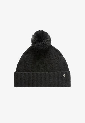 Black knit beanie with a textured pattern, ribbed cuff, and a fur pom-pom on top. Features a small logo on the side.