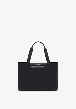 Borsa tote rettangolare nera con due manici e una piccola tasca frontale, con il logo "KAPTEN & SON" sul manico superiore.