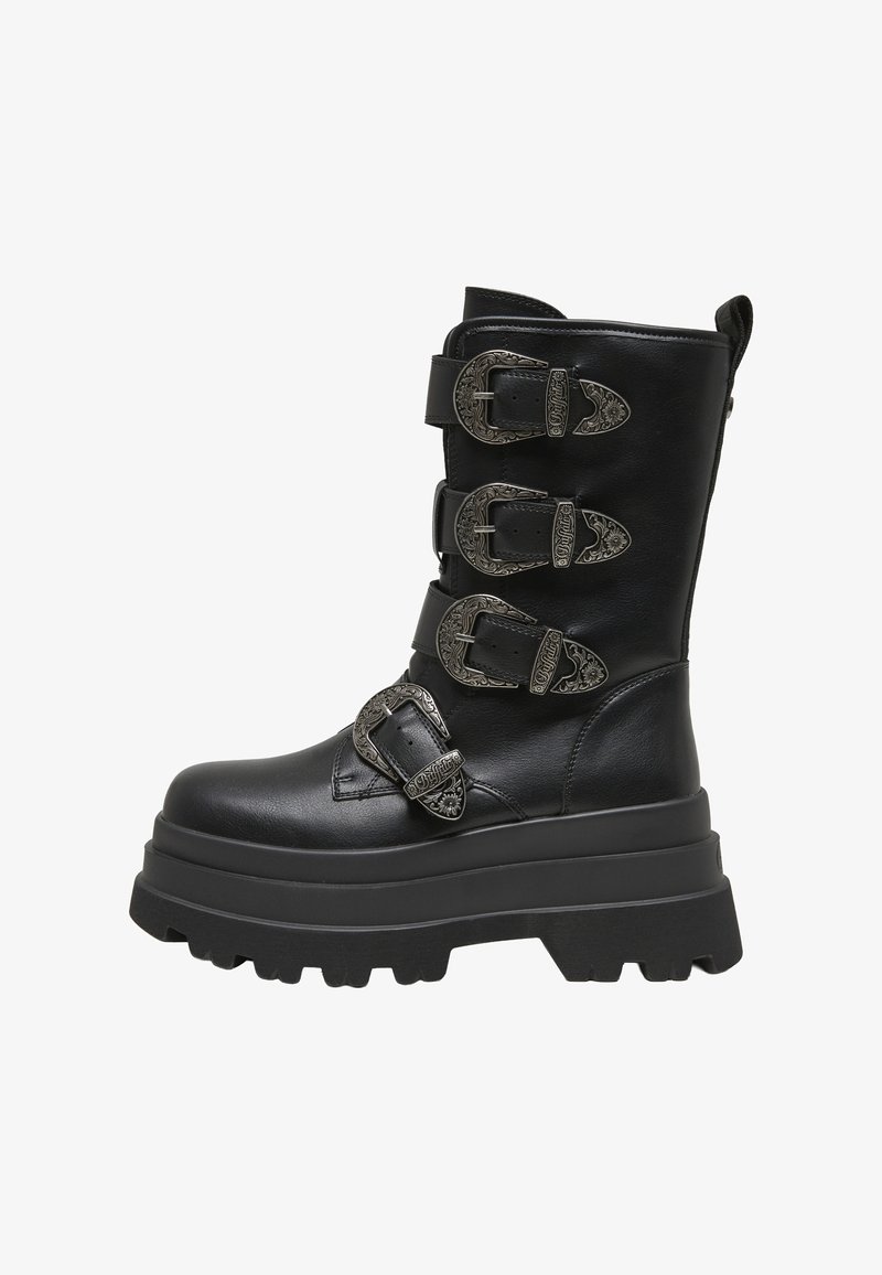Botte en cuir noir mi-mollet avec semelle plateforme épaisse et quatre boucles argentées décoratives avec motifs floraux gravés.