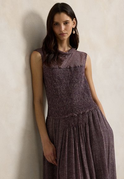 A sleeveless, textured dress in shades of purple, featuring a fitted bodice and a flowing skirt with gathered details.
