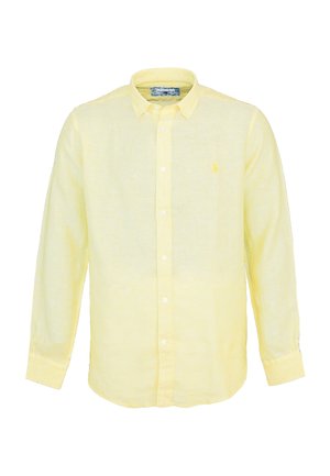 Camisa de lino amarilla clara con mangas largas, cuello abotonado y botones blancos. Presenta un pequeño logo en el pecho.