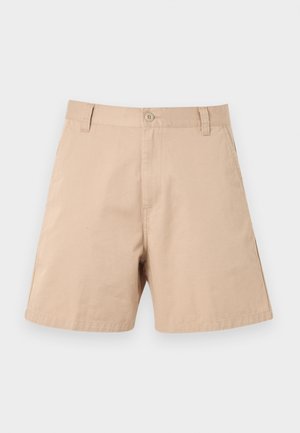 Beige bomullsshorts med frontknapp, beltehemper og sidelommer, vist flatt mot en lys bakgrunn.