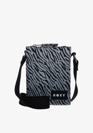 Small crossbody bag with black and grey zebra stripes, black adjustable strap, and "ROXY" logo patch on front.