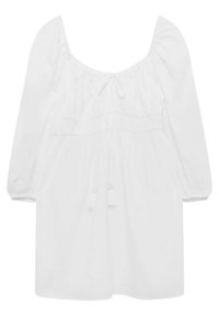 White blouse with a scoop neckline, gathered shoulders, 3/4 puff sleeves, and a cinched waist featuring a tie and tassels. Soft texture.