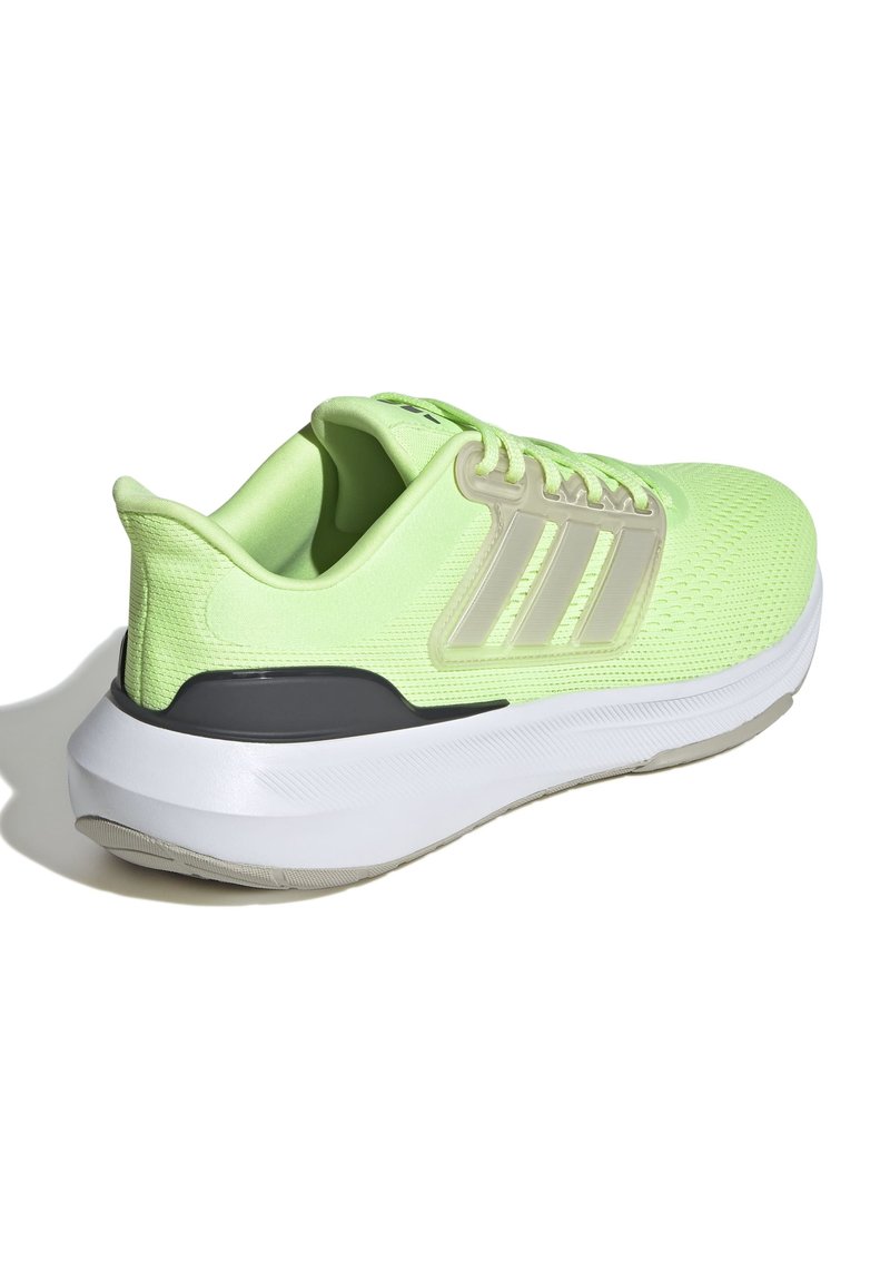 Zapatilla deportiva de color verde claro con parte superior de malla, acento gris en el talón, entresuela blanca y tres franjas características en el lado lateral.