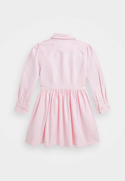 Pink cotton dress with long sleeves, buttoned cuffs, a collar, and a gathered skirt. Smooth texture with a solid color and minimal detailing.