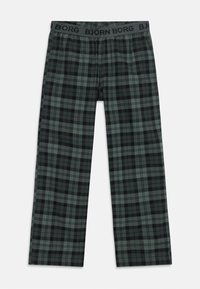 Dryžuoti kelnės su tamsiai žalia ir juoda raštu, pagamintos iš minkštos medžiagos, su elastinga juosta, ant kurios matomas "BJÖRN BORG" logotipas.