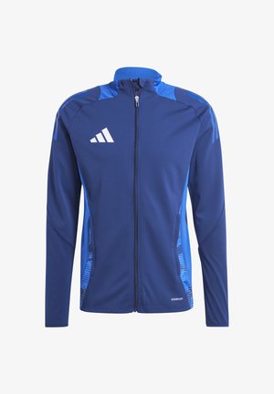 Blauwe sportjack met een volle rits. Gemaakt van gladde stof met een gestructureerd blauw patroon aan de zijkanten. Adidas-logo op de borst.