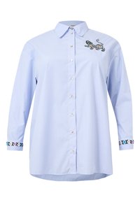 Blau- und weiß gestreiftes Langarmhemd mit bestickten Akzenten an den Bündchen und einer dekorativen Stickerei auf der Brust. Mit Knopfleiste vorne.