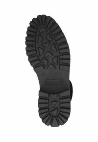 Suela de zapato de goma negra con profundas estrías, con un diseño en patrón. Logo y talla 37 grabados en la parte media.