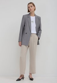 Calliope JOGGER  - Pantalon de survêtement - beige