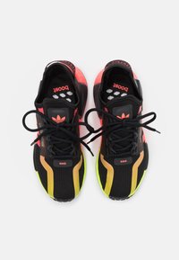Black and pink athletic shoes with mesh upper, contrasting yellow and orange accents, round toe, and lace-up design. Boost cushioning visible.