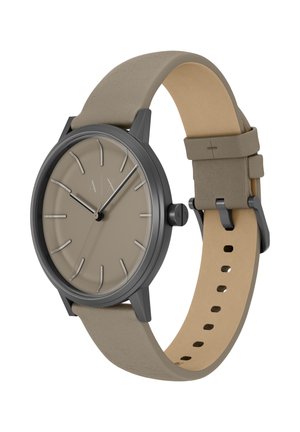 Rund ur med beige urskive, gråt urkasse og en lys grå læderrem. Har minimalistiske timeindikatorer og en enkel spænde.