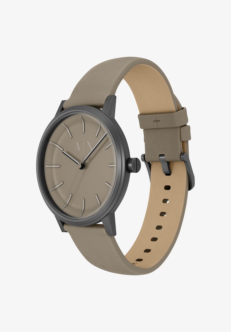 Montre ronde avec un cadran beige, un boîtier gris et un bracelet en cuir gris clair. Dispose de marqueurs d'heure minimalistes et d'une boucle simple.