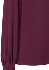 Burgunderfarbene Bluse mit langen Ärmeln und elastischen Bündchen, glatter Textur und lockerer Passform. Der Stoff wirkt weich und leicht.