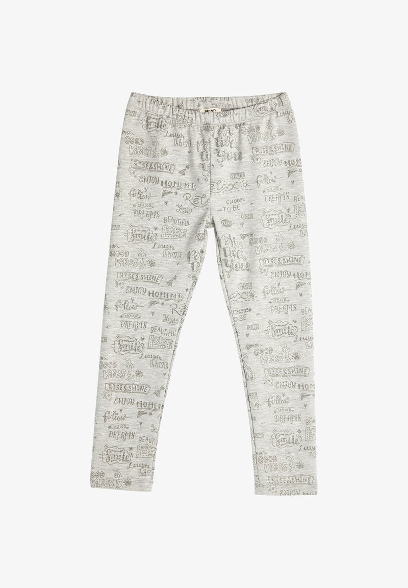 Graue Leggings mit elastischem Bund, die ein wiederholtes Muster aus handgeschriebenem, hellbraunem Text aufweisen, einschließlich Phrasen wie "Gute Vibes" und "Momente genießen."