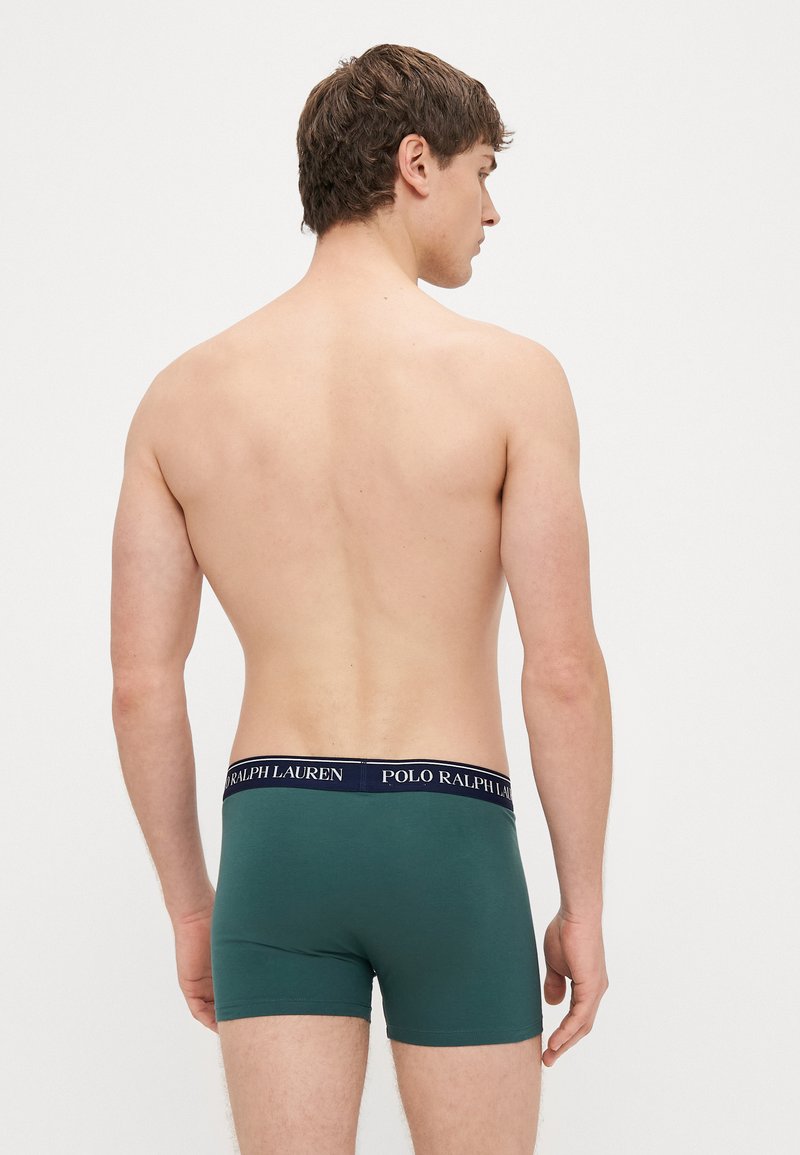Grüne Herren-Boxershorts mit navyblauem elastischem Bund und dem "Polo Ralph Lauren"-Logo, glatter Textur und enger Passform.