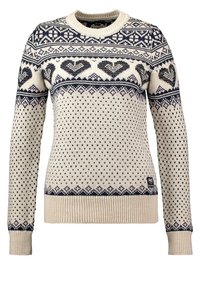 Pull crème avec motifs géométriques bleu marine et cœurs sur la poitrine, les manches et l'ourlet, doté d'un col, de poignets et d'une taille côtelés.