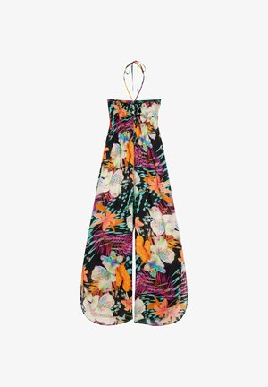 Bezramínkový overal s širokými nohavicemi a zavazováním za krk, zdobený oranžovými, růžovými, fialovými a bílými tropickými květy na černém pozadí.