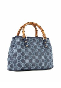 Sac navy avec poignées en bambou, tissu texturé, motif floral et accents en métal doré. Forme carrée, côtés souples et base renforcée.