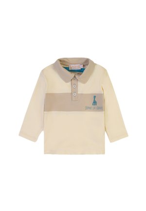Polo a maniche lunghe in giallo chiaro con una striscia beige. Presenta bottoni e un logo di giraffa ricamato in turchese. Materiale in cotone morbido.