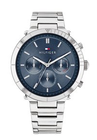 Montre en acier inoxydable argenté avec un cadran bleu, présentant trois sous-cadrans et des index des heures argentés. Inclut le logo de la marque sur le cadran.