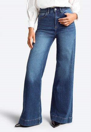 Wide-leg blue denim jeans featuring a high waist, classic five-pocket design, light wash fading, and contrast stitching.