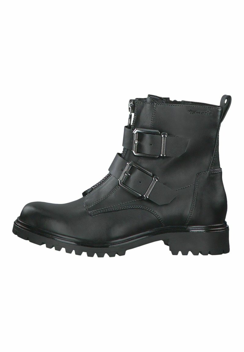 Botte en cuir noire à la cheville avec fermeture éclair sur le côté, deux boucles avant réglables, finition texturée et semelle robuste avec motif de traction.