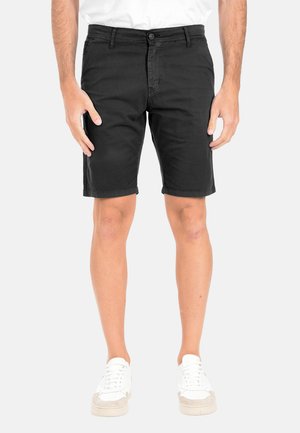 Pantaloni corti neri in cotone con taglio dritto, dotati di chiusura frontale con bottone e zip, tasche laterali e una texture liscia.