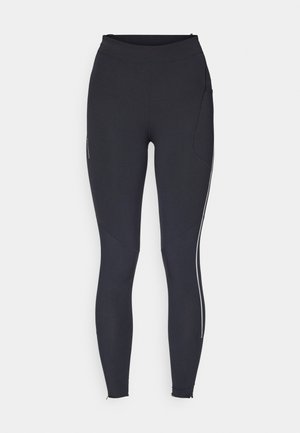 Mustad mustriga mustad treeningleggings, millel on kõrge vöökoht, istuv disain, küljetasku ja kontrastne valge triip välimise jala õmbluse ääres.
