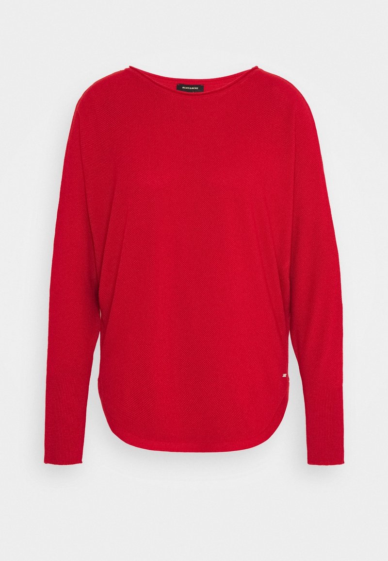 Pull à manches longues rouge vif en maille avec un col rond et un motif texturé subtil, présenté sur un fond blanc.