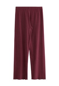 Burgundy vida byxor med breda ben tillverkade av mjuk ribbad tyg, med elastisk midja och rå, något fransig nederkant.