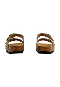 Sandali in sughero marrone con due larghe cinghie, retro aperto e suola piatta. La base testurizzata e le cinghie lisce offrono un design minimalista.