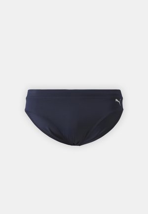 Marineblauwe bikini onderkant van gladde stof, met een low-rise ontwerp en een klein logo accent aan de linkse heup.
