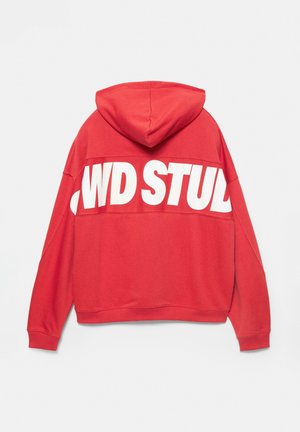 Red hoodie featuring a large white graphic print on the back that reads "WD STUD." Made of soft fabric with a relaxed fit and drawstring hood.