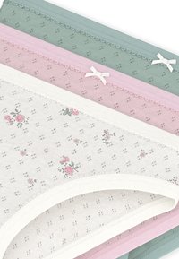 Βαμβακερά σλιπ σε λευκό, ροζ και πράσινο, με λουλουδάτα μοτίβα και λεπτή δαντέλα με μικρά φιόγκους που αναδεικνύουν τις μέσες.