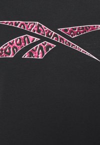 Abstract pink and black leopard print shapes on a black textured background, arranged in a curved, angular pattern.