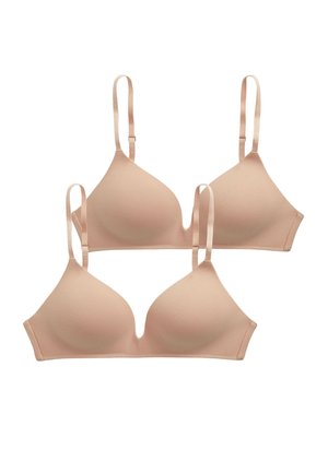 Beige wireless bra with a smooth, unpadded design, featuring adjustable straps and a v-neckline. Matching beige thong with logo detail.