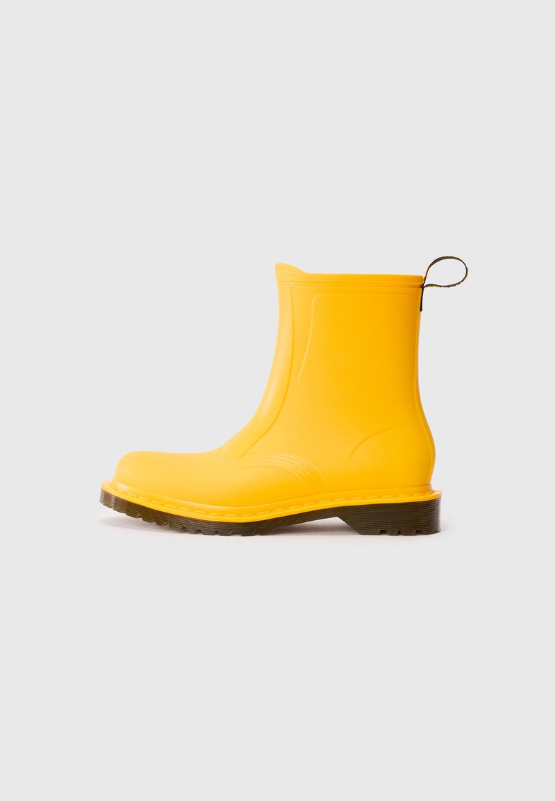 Yellow waterproof rubber boot with a rounded toe, textured upper, and a sturdy black rubber sole. Features a loop at the back for easy pull-on.