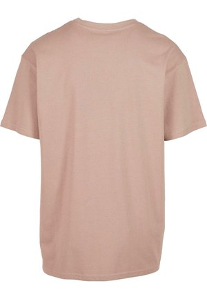 Kortärmad t-shirt i mjuk persikofärgad tyg. Rund hals, avslappnad passform, slätt sydda fållar, och inga synliga mönster eller grafik.